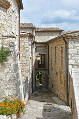 Fototapeta na wymiar A narrow street between the old houses of Gesualdo, a village in the province of Avellino