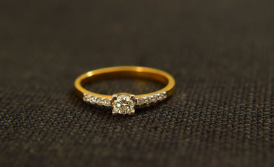 Obraz na płótnie Canvas jewelry Gold ring set with diamonds Luxurious, expensive