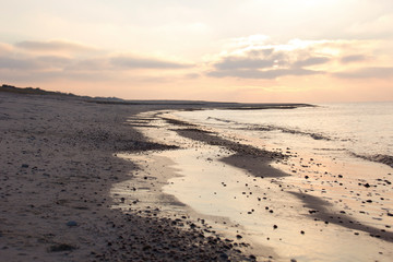 beautiful sandy beach on the sea at sunset, magnificent, cold baltic sea
