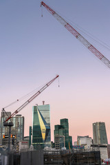 Fototapeta na wymiar 東京都港区六本木のクレーンと高層ビルの夕景