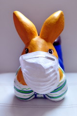 easter bunny in protective medical masks quarantine concept for easter holiday due to epidemic.