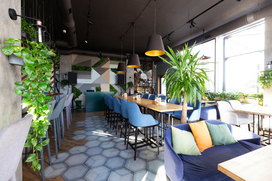 Light Modern Interior Of Urban Restaurant Or Cafe With Dining Places