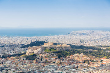 Fototapeta premium cityscape of Athens in day time with the Acropolis seen from Lycabettus Hill, the highest point in the city