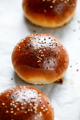 fresh homemade hamburger buns, baps on baking paper