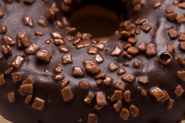 Chocolate donut on a white background close-up.