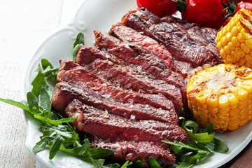 Rib eye steak on wooden board