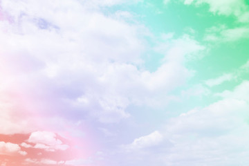 Cloud and sky with a pastel colored background.