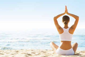Fototapeta na wymiar Yoga Meditation Exercise, Relaxing Woman sitting on Sea Beach Coast, Outdoor Fit Workout