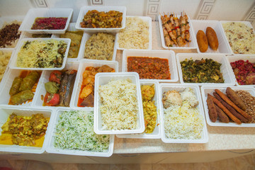 Delivery sets of healthy and delicious food in boxes . A variety of fast food in plastic boxes .
