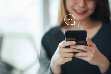 Women's hand typing on mobile smartphone, Live Chat Chatting on application Communication Digital...