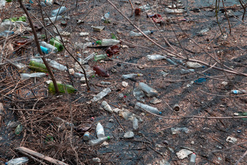 Obraz premium plastic bottles and other rubbish in river water. pollution of the oceans and the environment. dirty lake water