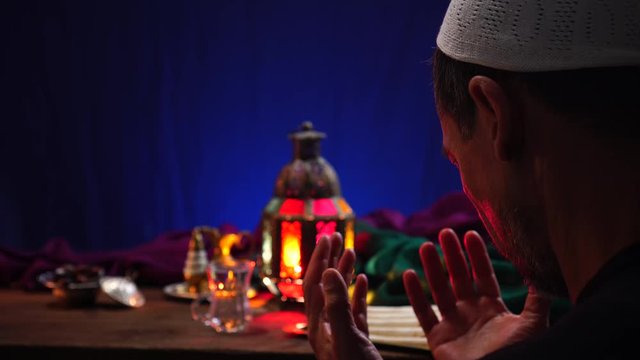 A Muslim man prays. During the entire month of Ramadan, Muslims are obligated to fast every day from dawn to sunset. Fasting requires the abstinence from food and drink