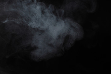 White steam on a black background.