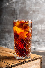 Cold cola beverage in glass with ice. Selective focus. Shallow depth of field.