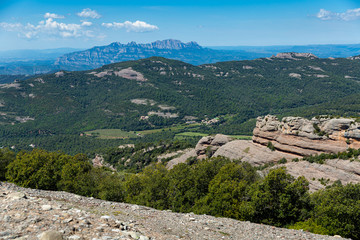 Fototapeta na wymiar Landscape with mountains at Park Natural de Sant Llorenc del Munt, Spain