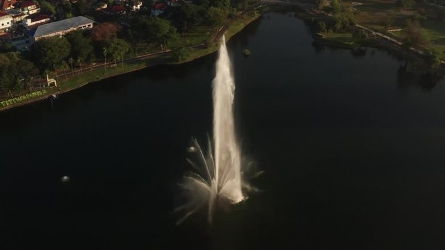 high pressure man made water fountain in a large lake