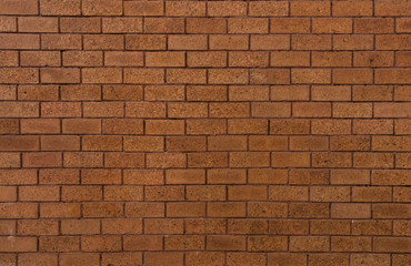 bricks red and broen color arranged in rows on wall