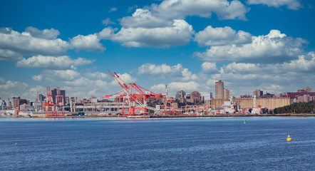 Red and white shipping cranes on the industrial coast of Halifax, Nova Scotia - obrazy, fototapety, plakaty