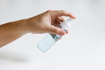 man hand and alcohol spray on white background