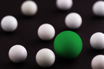 Green Ball white balls black background