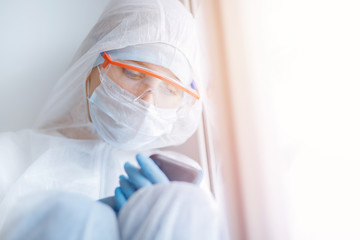 Quarantined patient awaits results of tests for positive coronavirus in hospital, and informs family by phone about news