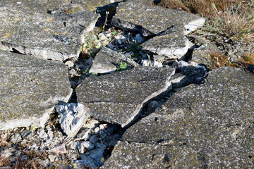 The surface and texture of the destroyed concrete slab.