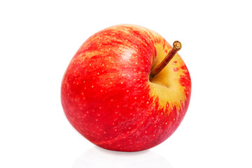 Juicy red apple. Isolated on a white background. Healthy diet and vegan nutrition. Close-up.