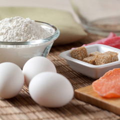 raw eggs, flour, brown sugar and dried fruits for making delicious homemade dessertss