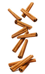 Falling delicious cinnamon sticks, isolated on white background