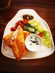 Prague, Czech Republic - August 10 2018: Healthy lunch, wraps, sauce and salad