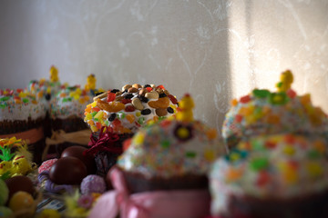 Easter cake with candles, flowers and nuts