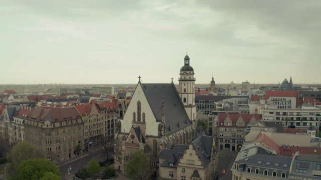 Top panoramic aerial view over St. Thomas Church (Thomaskirche) in Leipzig in Saxony, Germany