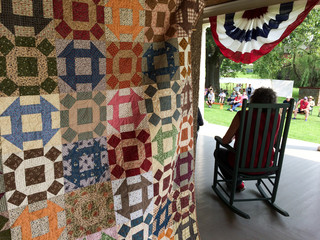 american civil war reenactment house with quilt