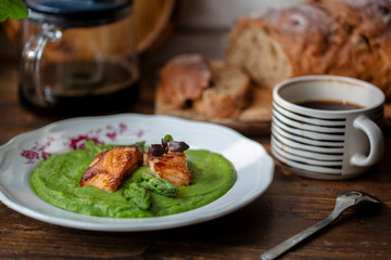 Fototapeta na wymiar healthy breakfast: wholewheat bread, baked salmon and asparagus sauce