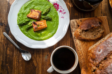 healthy breakfast: wholewheat bread, baked salmon and asparagus sauce