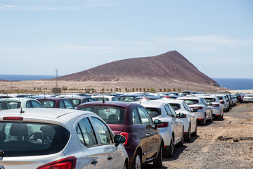 Fototapeta na wymiar Coronavirus crisis left 40000 rental cars parked next to the airport of Tenerife without tourist coming to visit the island.