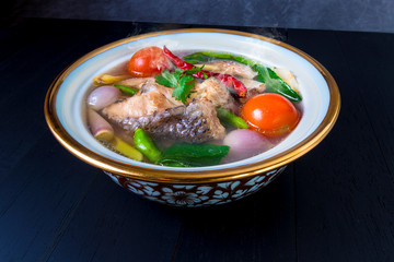 Thai fish soup,clear soup fish with herbs Thai style know as 'Tom Yum Pa Nam Sai' delicious dish for homemade food white background