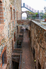 The stone walls of the casemates in an ancient fortress in Savona, Italy