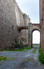 The stone walls of the casemates in an ancient fortress in Savona, Italy