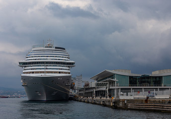 Large white cruise ship in the port of Savona, Italy