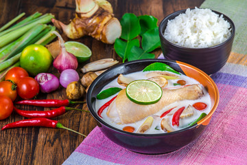 Chicken and Galangal in Coconut Milk Soup (Tom Kha Gai),Coconut milk soup with chicken and rice on the table, Thai food that is popular in Thailand.
