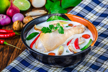 Chicken and Galangal in Coconut Milk Soup (Tom Kha Gai),Coconut milk soup with chicken and Thai ingredients on the table, Thai food that is popular in Thailand.