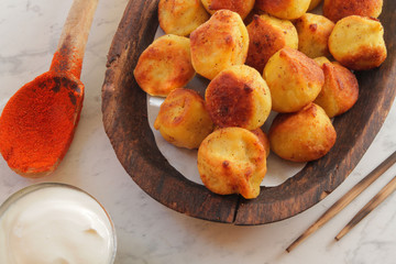 
dumplings, ravioli, fried with spices and sauce.