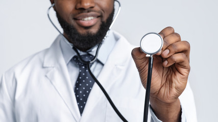 Cropped of young black therapist using stethoscope
