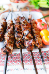 Ready kebab on the table. Grilled meat. Lunch cooked on coals.
