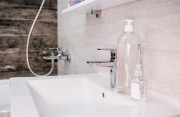 white sink in the bathroom, pandemic hand disinfection, carpet 19, disinfectant, soap and tap