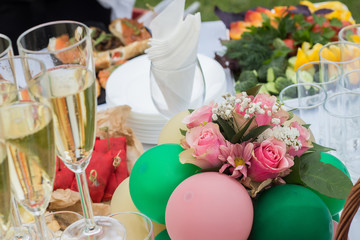 Festive table with drinks balls and flowers