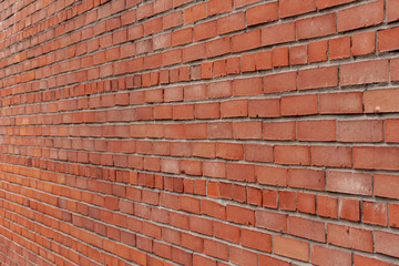 Exterior brick wall. Horizontal masonry.  Red brick. Brick textures.