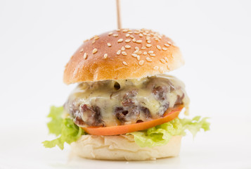  cheese burger , tomato and lettuce on a white background