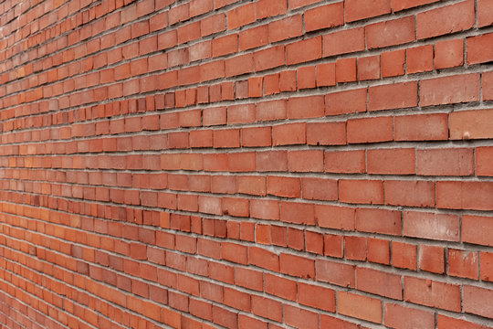 Exterior brick wall. Horizontal masonry.  Red brick. Brick textures.